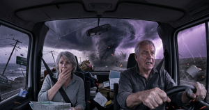 Senior Grey Nomad inside their van, taking shelter and securing belongings during a cyclone in Australia