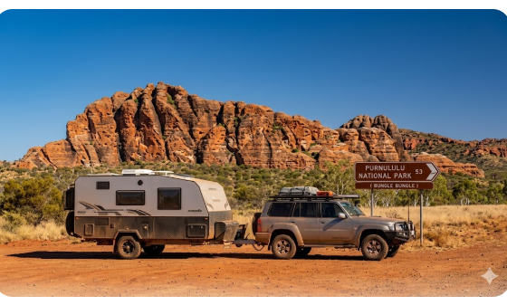 An off-road caravan parked at Spring Creek Rest Area with the rugged Kimberley ranges in the background near the Purnululu National Park turnoff.