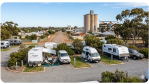 Small caravan park in Wickepin Western Australia with caravans parked on tidy powered sites beside a quiet Wheatbelt country town street.