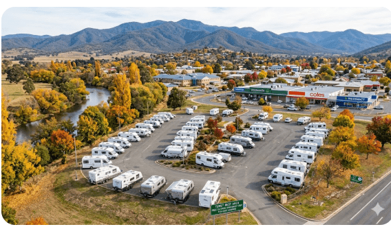 Tumut Rest Areas in the Snowy Mountains foothills at Tumut NSW 2720 — free 24-hour overnight stop for senior grey nomads on the Snowy Mountains Highway in 2026, showing the mountain valley setting with access to full town services including hospital, Woolworths, Coles and pharmacy, and the famous autumn colour landscape surrounding the Tumut River
