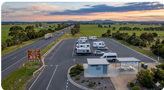 Basic toilet amenity block at Sale Princes Highway rest area Victoria Image description: Photo showing the basic amenity block at the Sale western approach rest area on the Princes Highway — illustrates the no-frills facility standard grey nomads should expect at this highway rest stop.